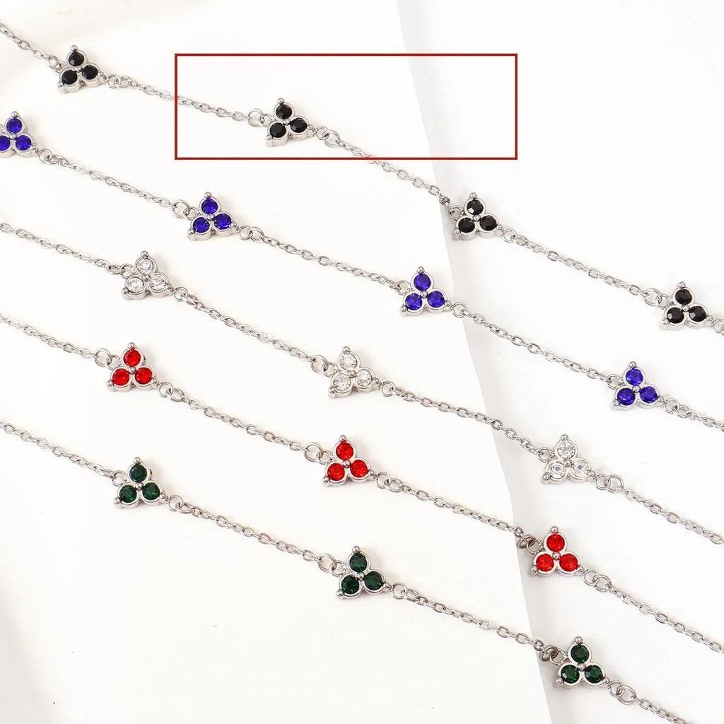 Stainless steel women's bracelet with three geometric diamond charms and zircon gemstones
