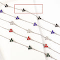 Stainless steel women's bracelet with three geometric diamond charms and zircon gemstones