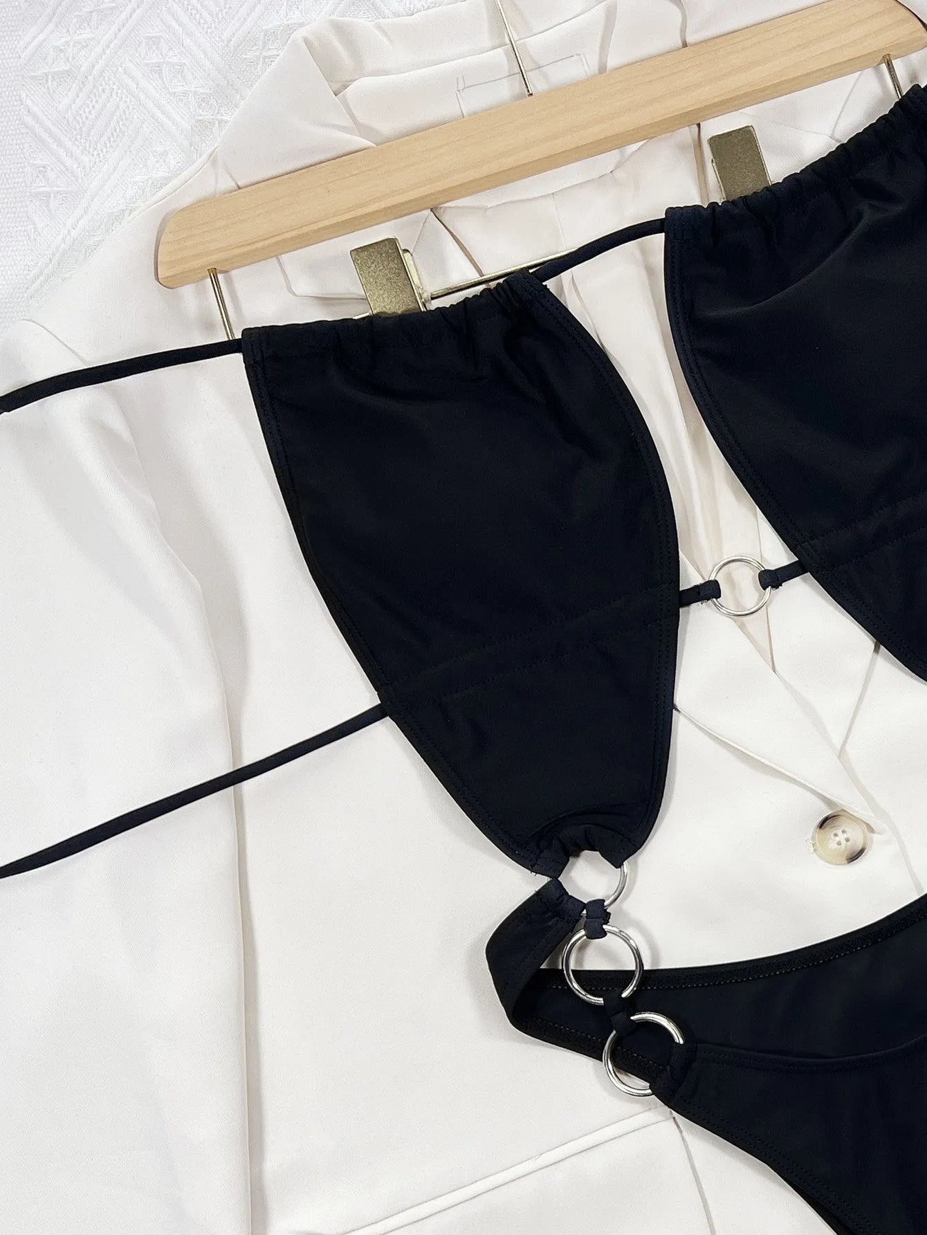 Steel Ring solid black sleeveless one-piece swimsuit for women on a white background.