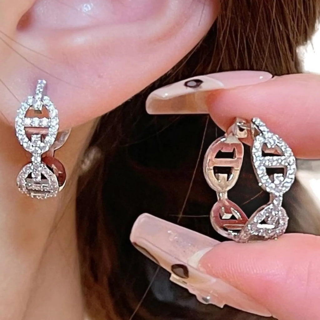 Women's diamond design electroplated earrings in silver, gold, and rose gold colour variations