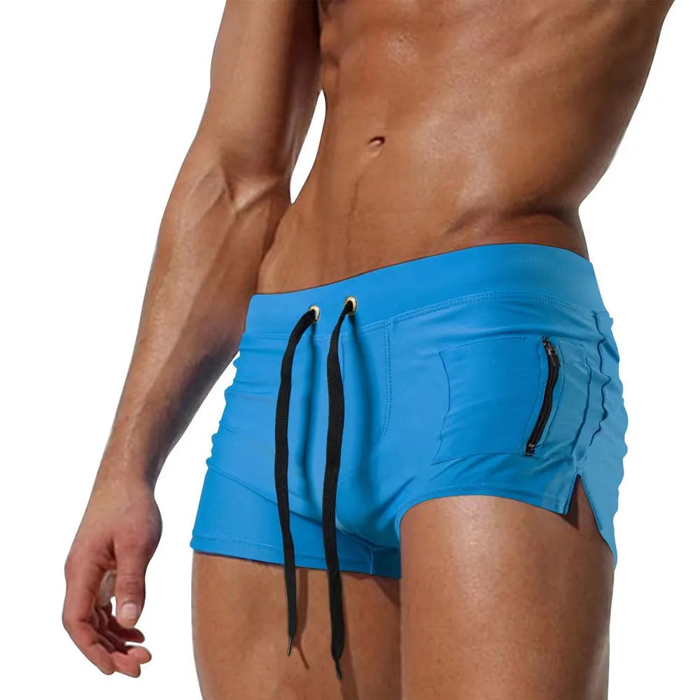 Men's black high waist swimming trunks with front lace-up closure on white background
