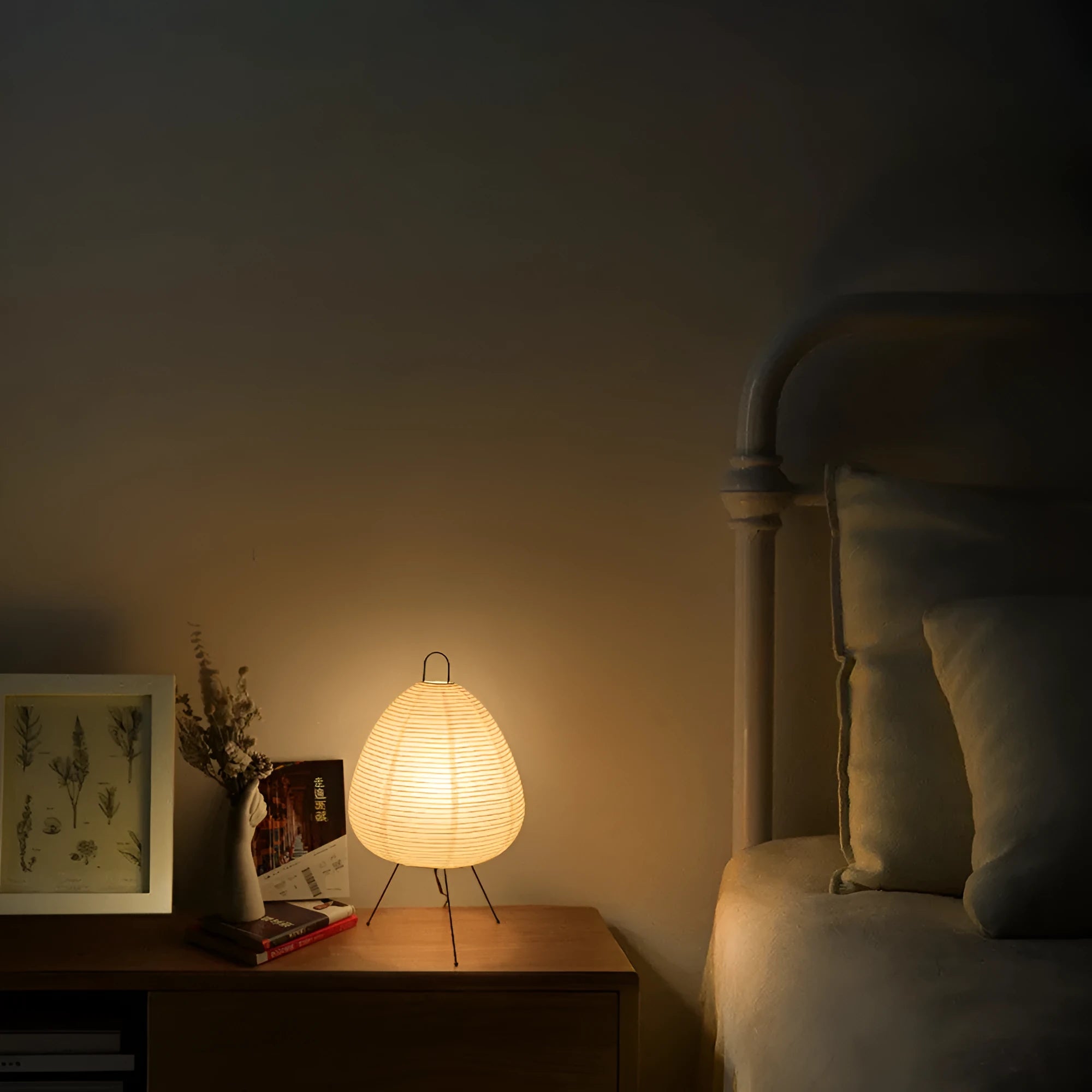 Japanese style table lamp with rice paper shade and aluminium base showing warm glow