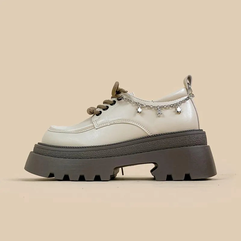 White women's platform Mary Jane shoes with chunky heel and front lace-up detail.