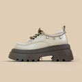 White women's platform Mary Jane shoes with chunky heel and front lace-up detail.
