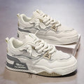 Men's white low-top board shoes with colour-matched details and rubber soles
