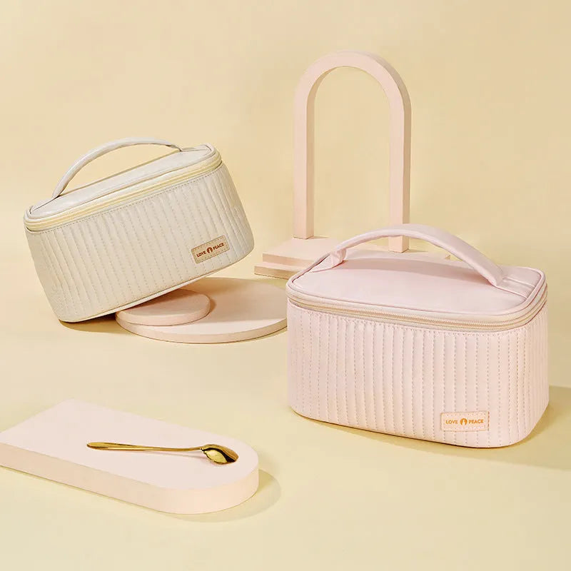 Open-top cake style makeup bag in soft PU leather, shown in one of six solid colour options.