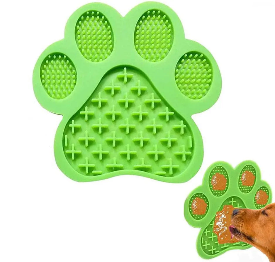 Blue bone-textured silicone dog licking mat with suction cups on a white tile wall