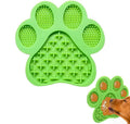 Blue bone-textured silicone dog licking mat with suction cups on a white tile wall