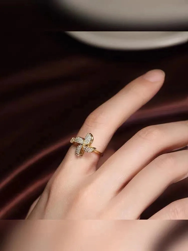 Geometric rotating ring with micro inlaid details in gold or silver electroplated finish
