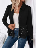 Women's black loose-fit coat with heavy-duty zipper front and ruffled hem detail.