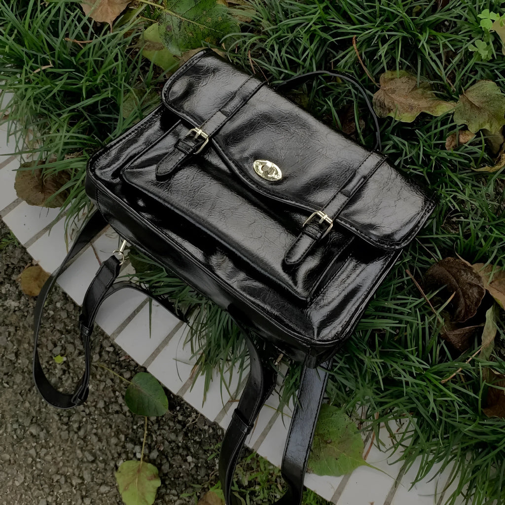 Black oil wax leather-style messenger bag for women with 35cm length and shoulder strap