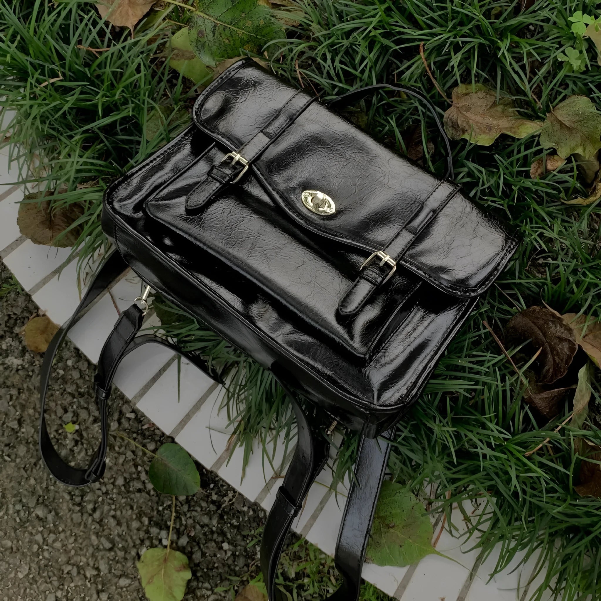 Black oil wax leather-style messenger bag for women with 35cm length and shoulder strap