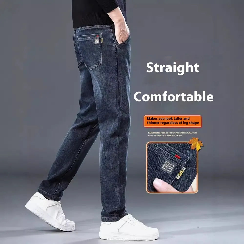 Man wearing slim straight blue-grey casual trousers with a micro-elastic fit and zipper fly.
