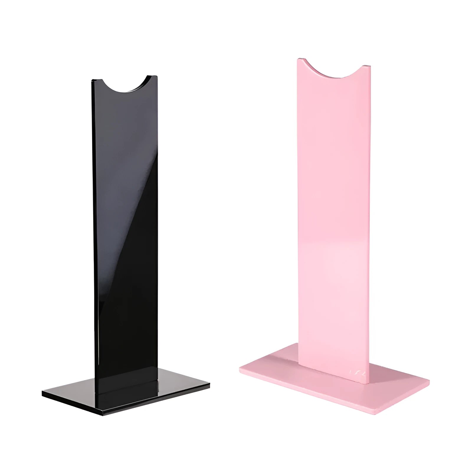 Pink and black detachable head-mounted gaming headset bracket on a desk