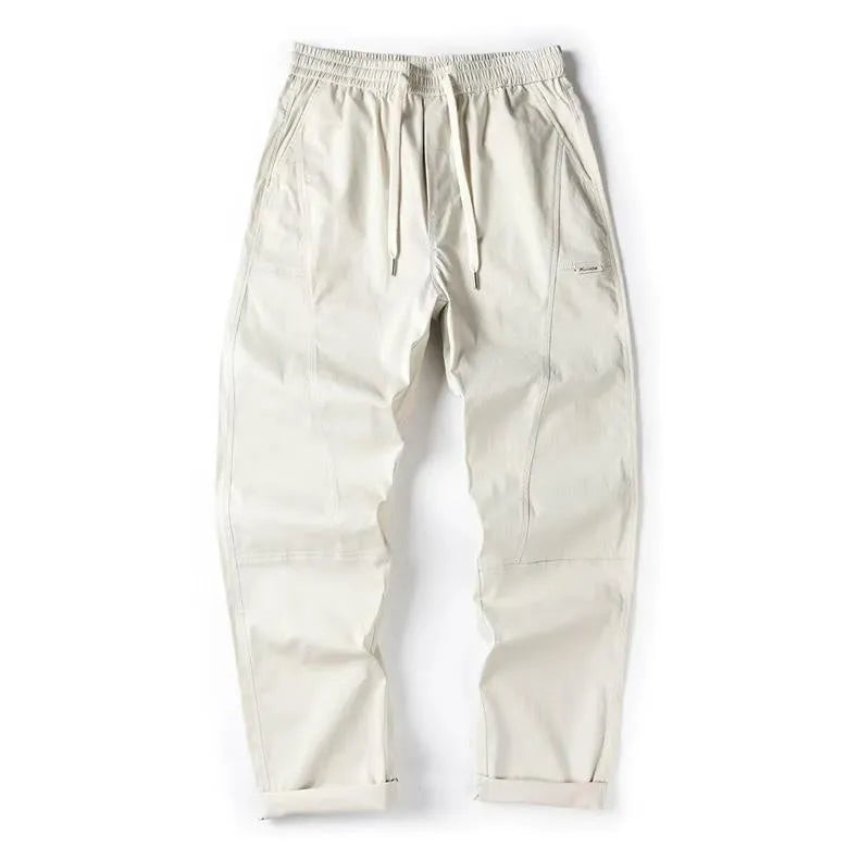 Cotton wide-leg trousers in milky white colour with a relaxed, straight-leg fit