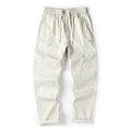 Cotton wide-leg trousers in milky white colour with a relaxed, straight-leg fit