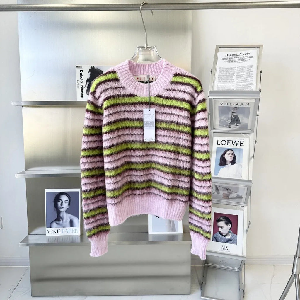 Pink women's wool knitted cardigan on a hanger, showing nap texture and regular sleeves.