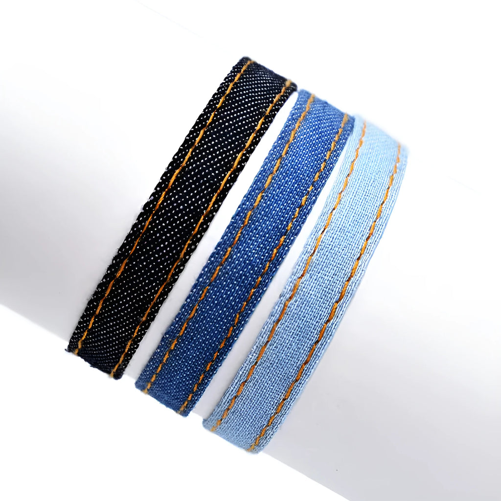 National style denim fabric bracelet carrying strap showing mixed material construction and wristband design