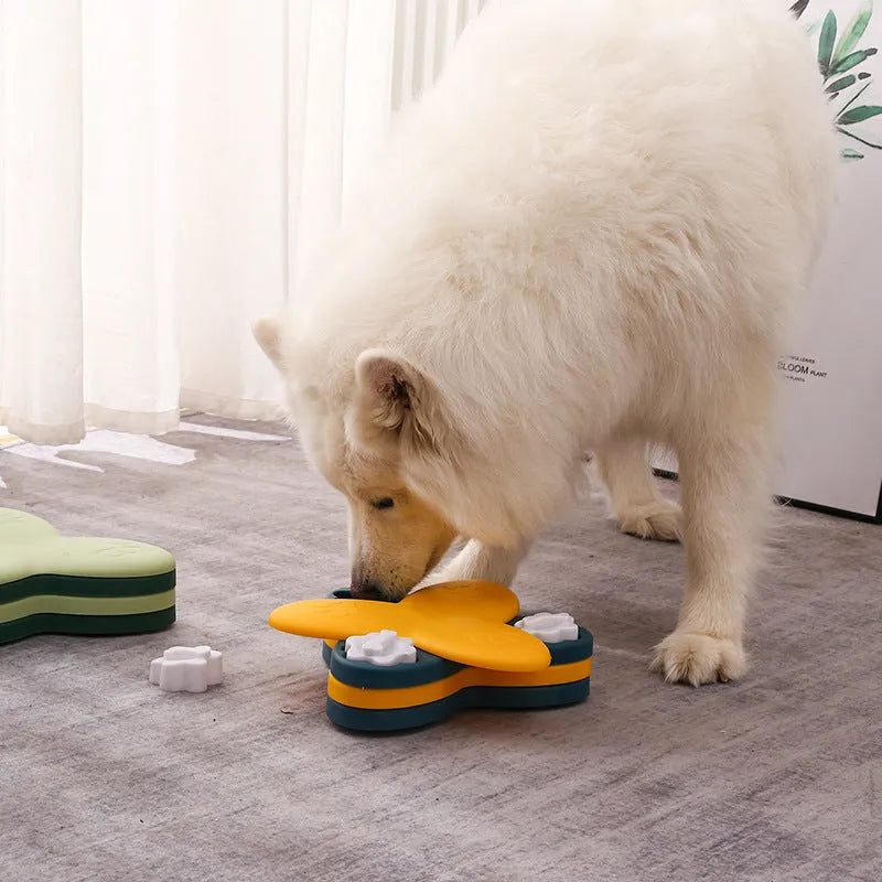 Green interactive dog puzzle bowl with bone-shaped covers on a non-slip base.