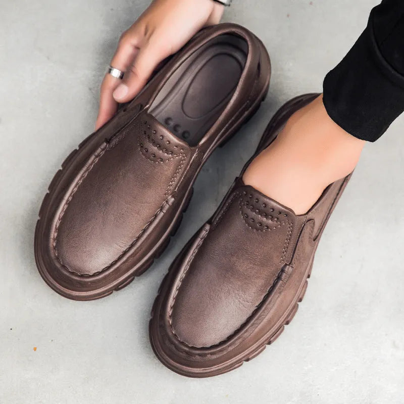 Men's black leather slip-on shoe with a mid-top design and platform sole