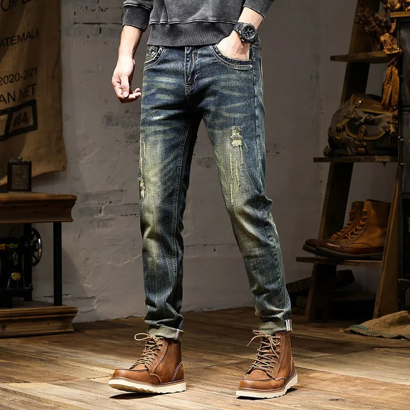 Man wearing retro blue skinny fit stretch denim jeans with a zip fly.