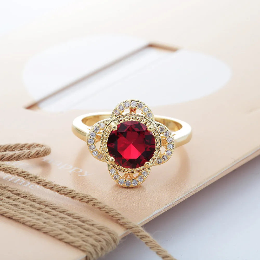 Copper ring with a fruit-shaped zircon stone inlaid, shown in UK size 7, 8, or 9.