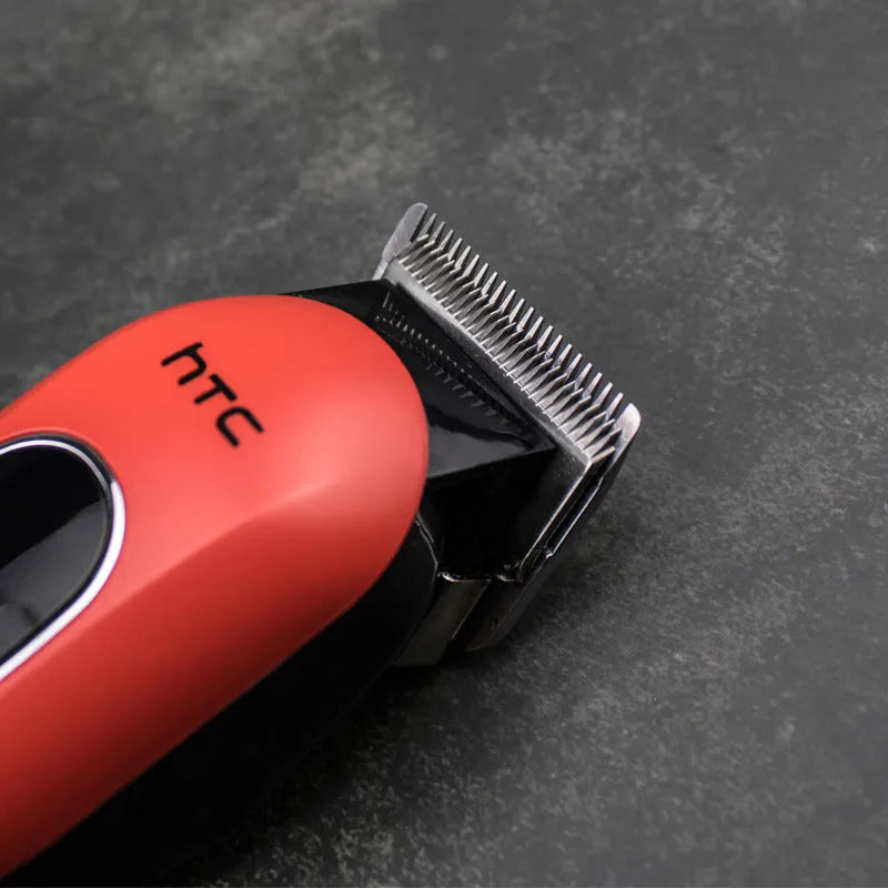 Professional digital electric hair clipper kit with brushless motor, charger, combs, and lubricating oil in black, red, or white.