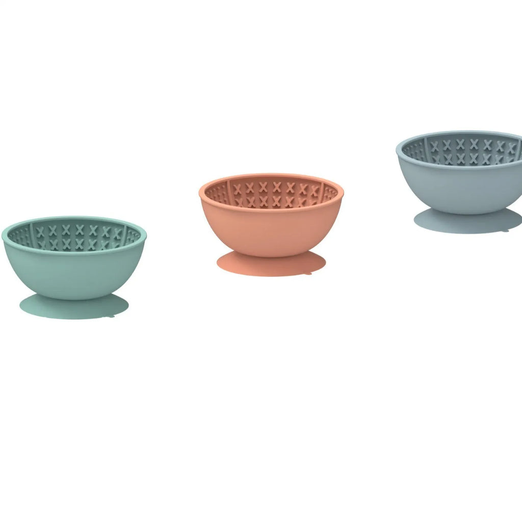 Cyan silicone pet slow feeding bowl with textured licking mat surface and suction cup base