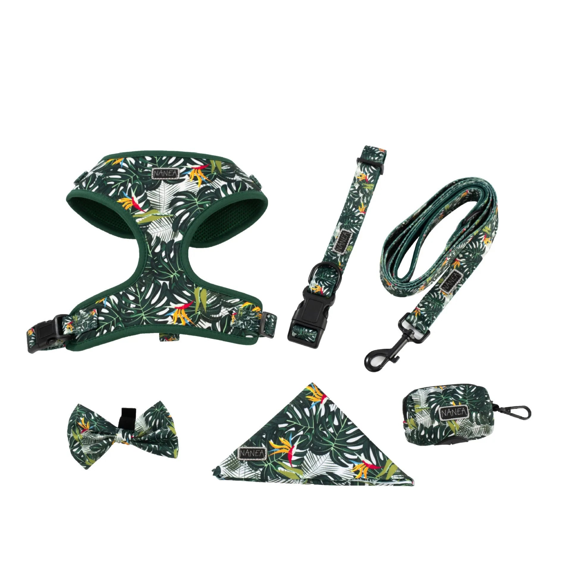 Six-piece pet harness set showing chest and back harness, hand-holding rope, collar, toilet bag, bow tie, and triangular scarf on a cloth background