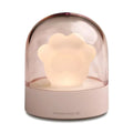 Pink cat paw shaped USB rechargeable night light with musical box function on wooden desktop