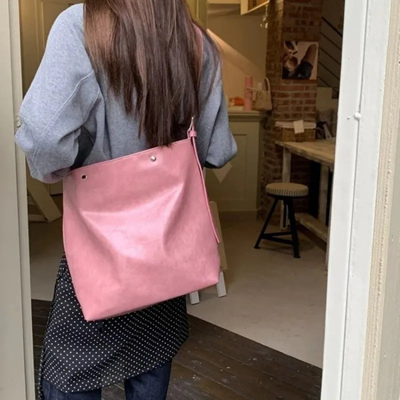 Corduroy commuter shoulder bag in pink or brown with PU lining and single strap
