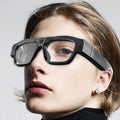 Black head-mounted smart Bluetooth glasses with transparent lens and integrated camera for video recording