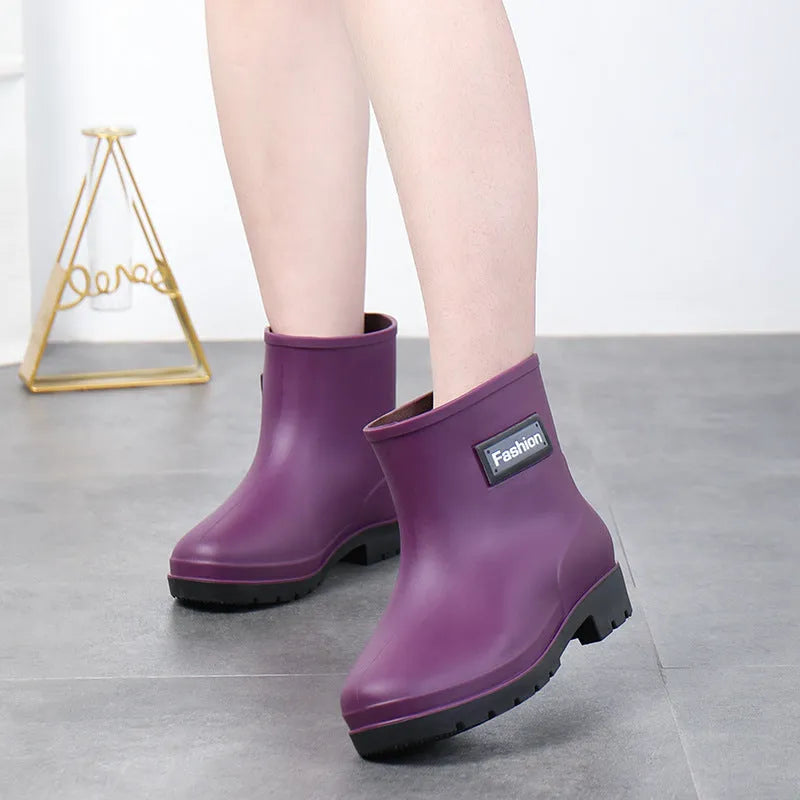 Women's mid-calf PVC rain boots in black with low heel for waterproof work footwear