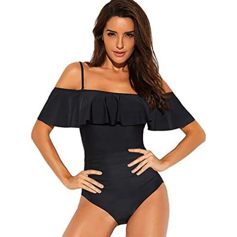 Black one-piece swimsuit with ruffled cut-out tube top design on a mannequin.