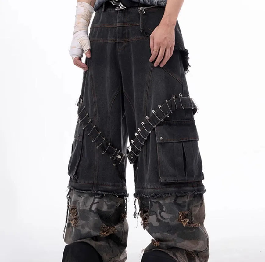 Men's grey jeans with camouflage print panels and ribbed texture panels on the legs.