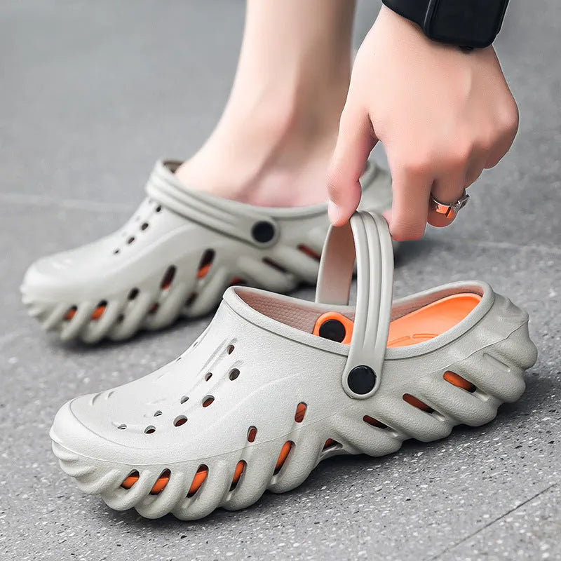 Men's beige EVA sandals showing hollow-out breathable design and round toe shape on a non-slip sole.