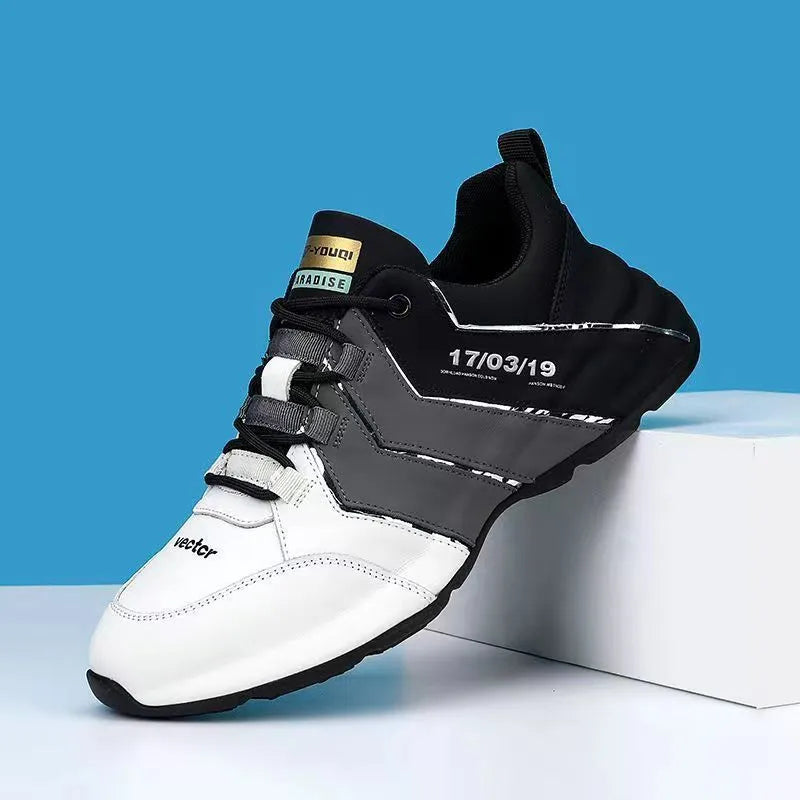 Casual low-top sneaker for teens in black and grey with thick plastic sole and lace-up front.