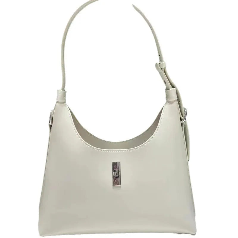 Women's soft genuine leather crossbody shoulder bag in a dumpling shape, shown in a light colour.