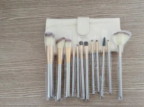 Persian makeup brush set with rice white brush heads and champagne colour handles in professional brush roll
