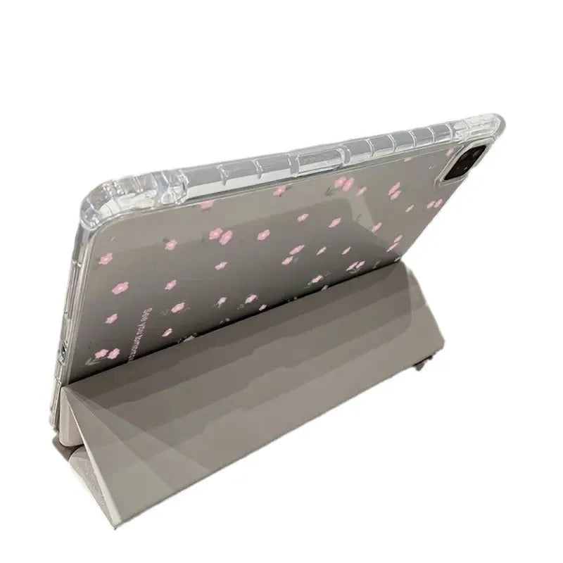 Transparent floral tri-fold iPad protective case showing magnetic stand functionality for Apple tablet models