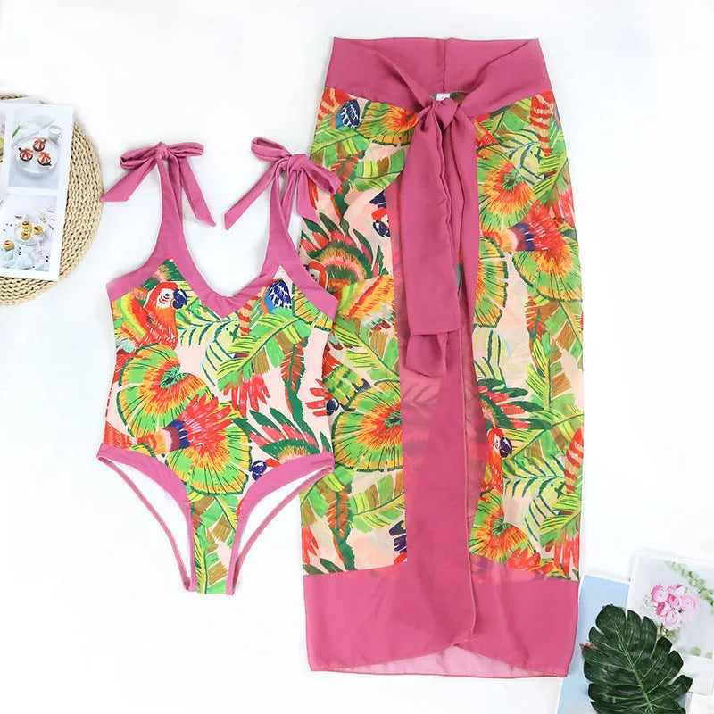 Retro pink floral print one-piece swimsuit with V-neck, covered belly, and thin skirt