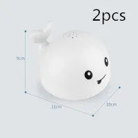 Automatic electric whale bath toy spraying water with flashing coloured lights