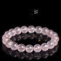 Women's natural starlight crystal bracelet with polished round pink beads in single circle configuration