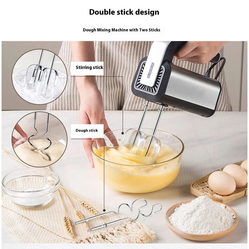 Silver handheld electric mini whisk with stainless steel beaters and five-speed control dial.