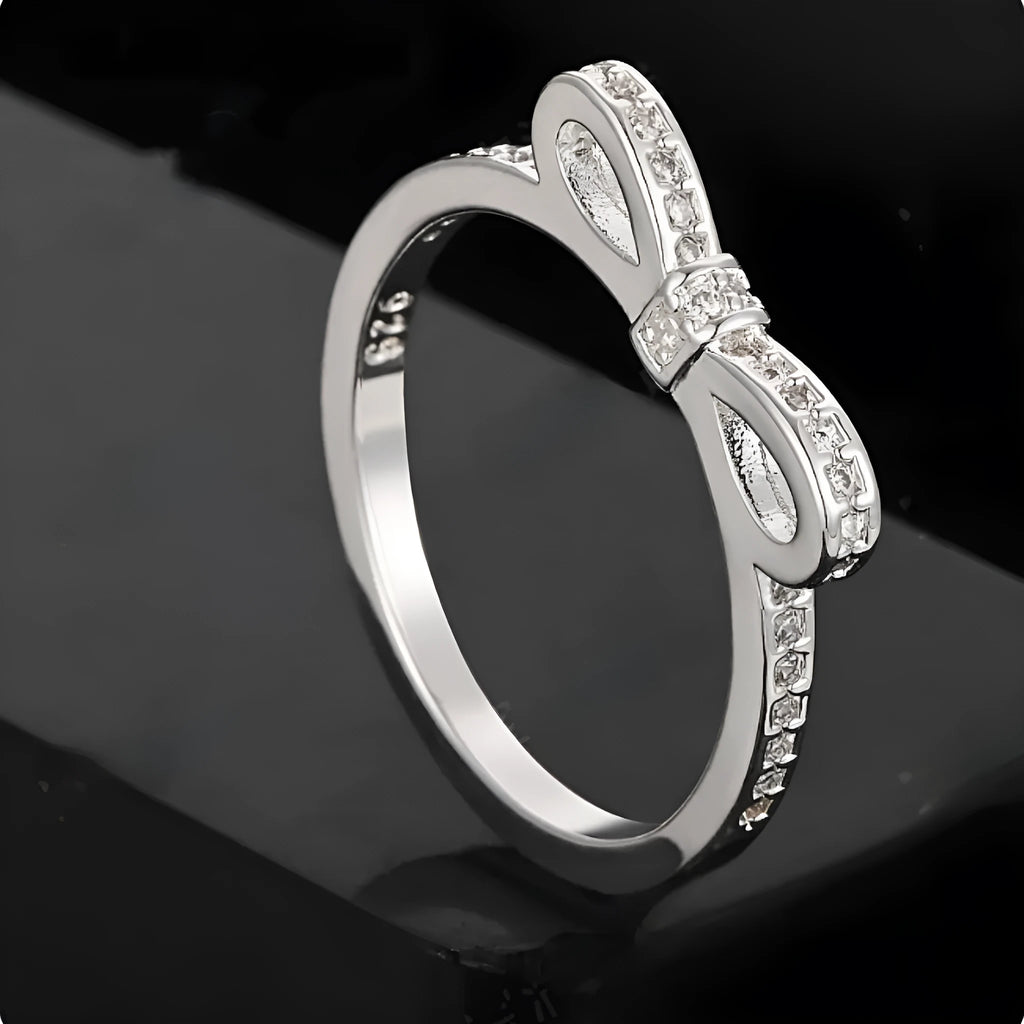 Silver bow ring with rhinestone crystals in couple style band design