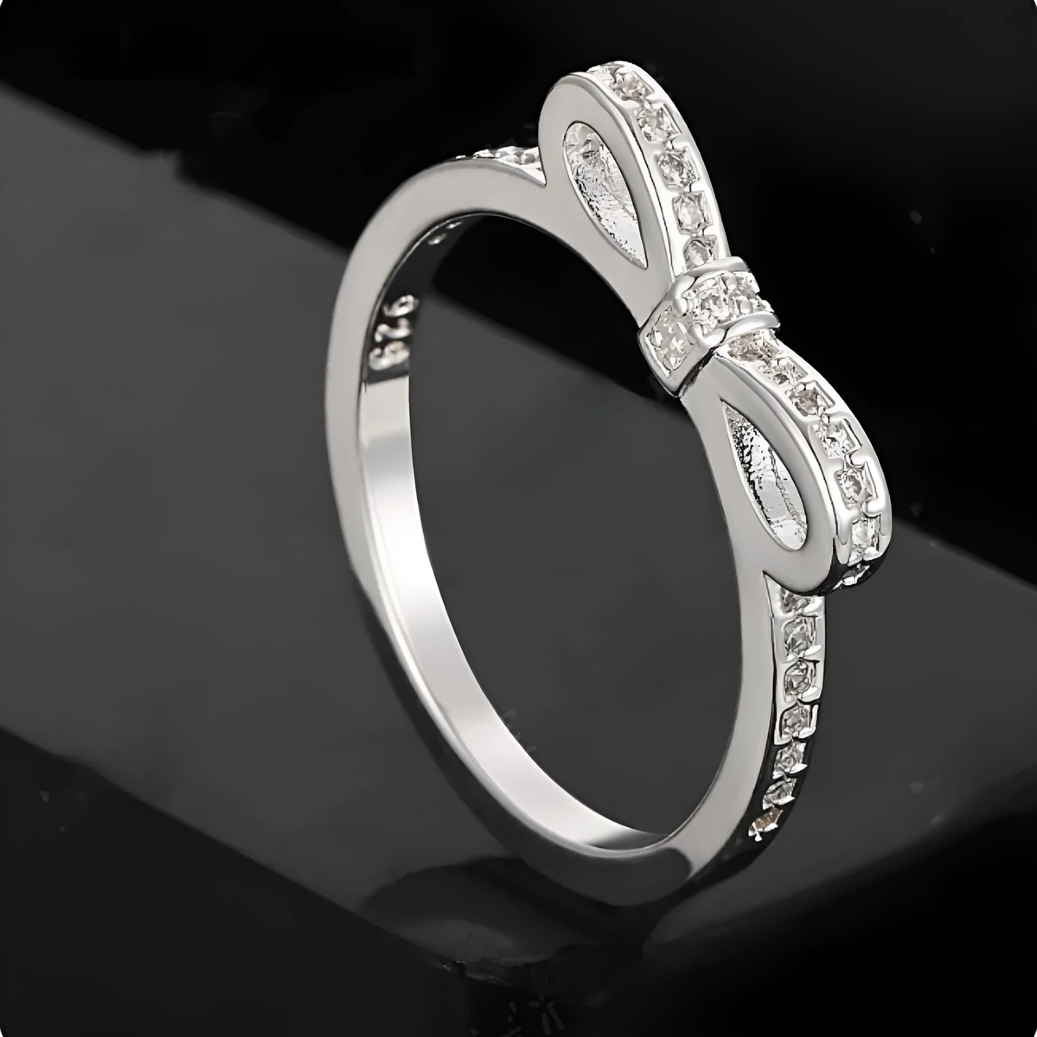 Silver bow ring with rhinestone crystals in couple style band design