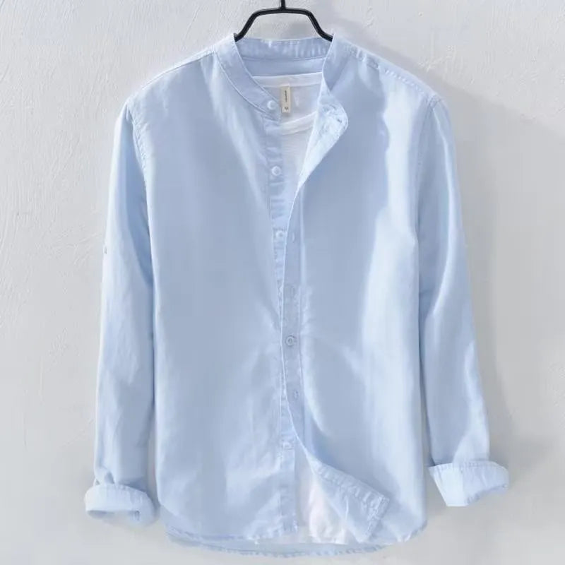 Loose fit long sleeve cotton linen shirt in solid colours on a hanger.
