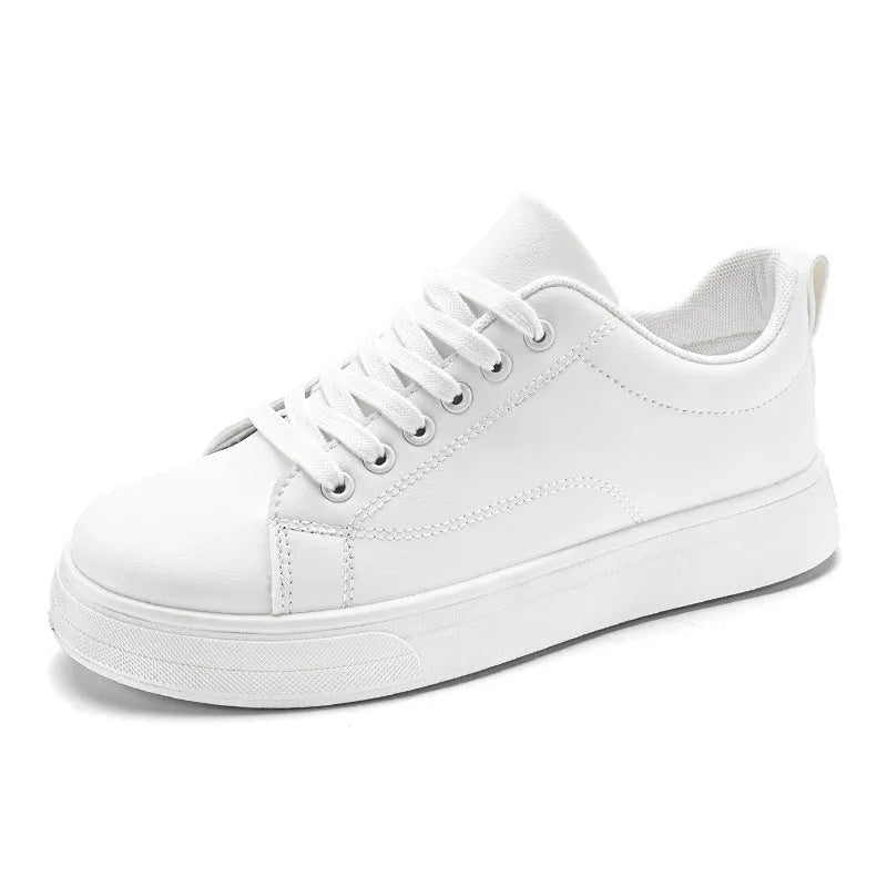 Men's low-top casual sneakers in white, black, or black with white sole, showing round toe and flat rubber sole.
