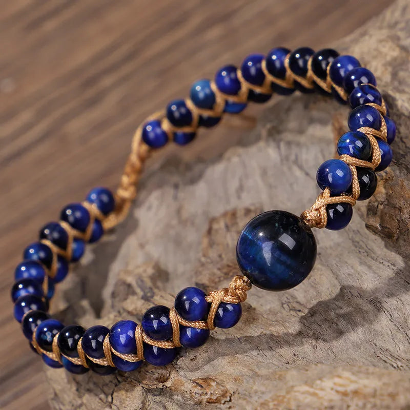 Hand-woven geometric bracelet made from tigereye stone with an adjustable sliding knot, shown in blue colour