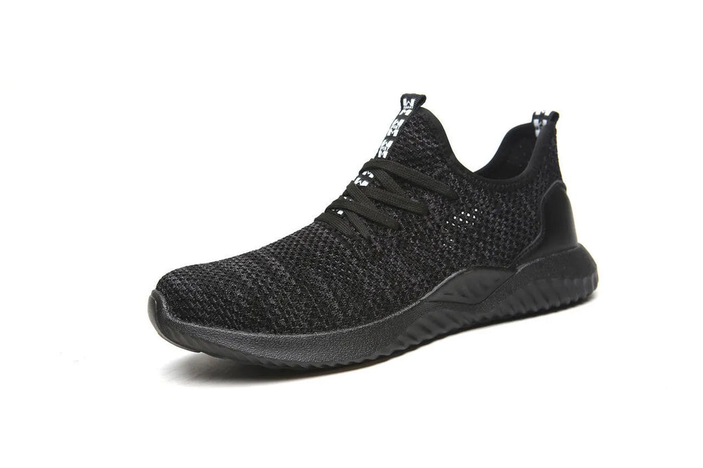 Low-cut black safety work shoes with a steel toe cap and EVA midsole on a grey background.